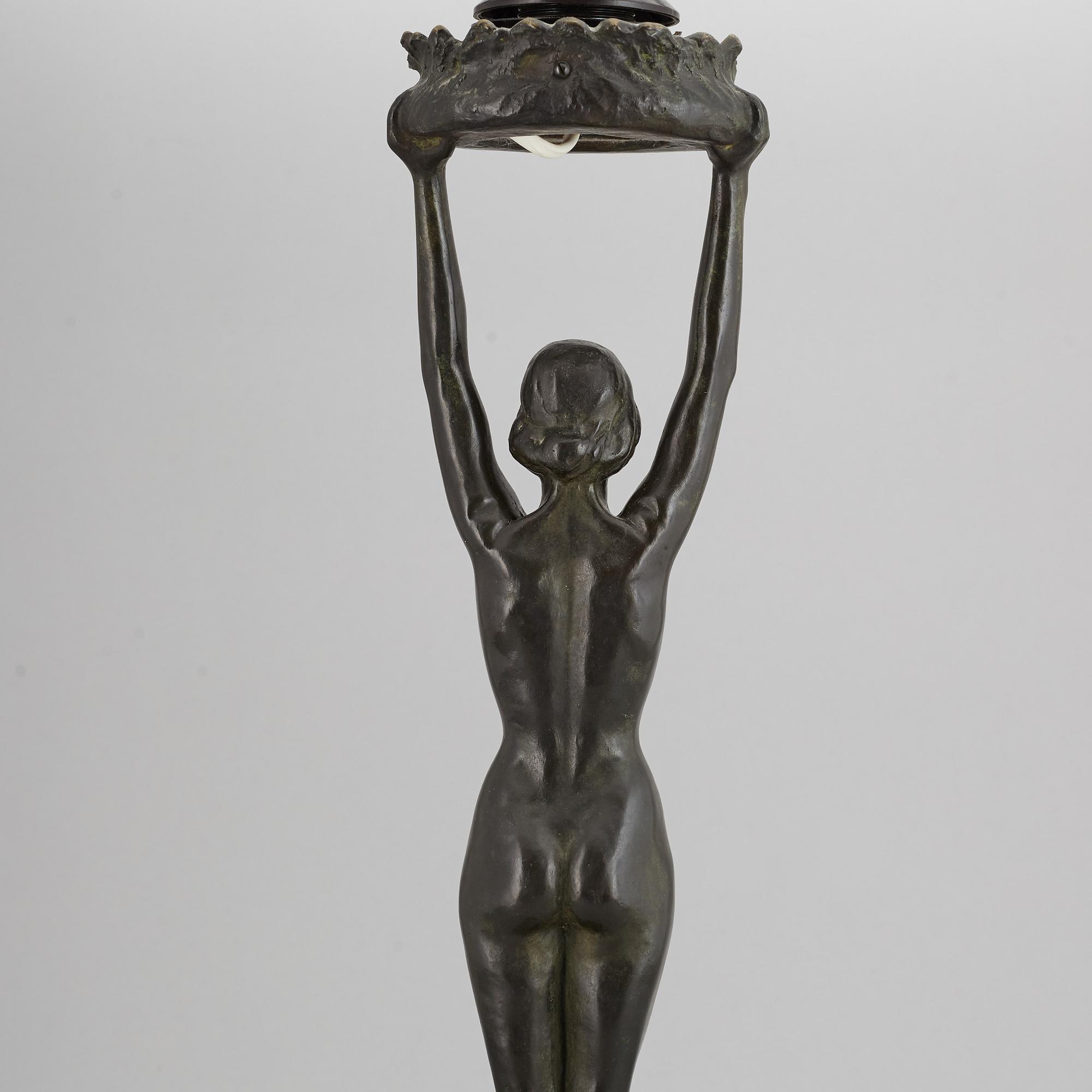 GERDA SPRINCHORN, an Art Nouveau green patinated bronze lamp "The Sun", Herman Bergman, Stockholm, early 20th century.