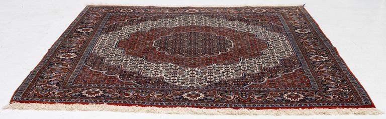 An Oriental rug, approx. 213 x 201 cm.