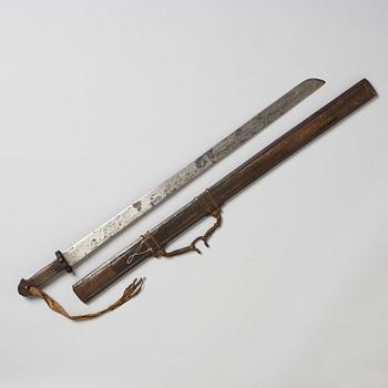 A Tibetan classig long broad blade sword with scabbard, 19th Century.