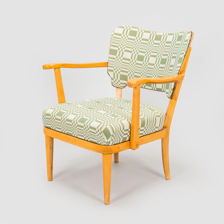 A mid-20th century armchair upholstered with fabric by Johanna Gullichsen.
