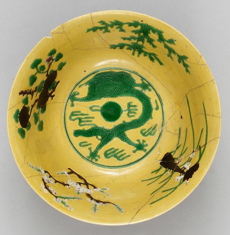 A pair of yellow ground 'dragon bowls', Qing dynasty, with Kangxis six character mark.