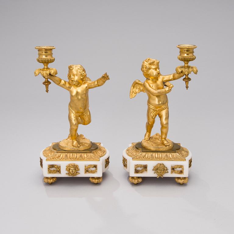 A PAIR OF GILT CANDLESTICKS, gilt bronze and white marble, sign CH, late 19th century.