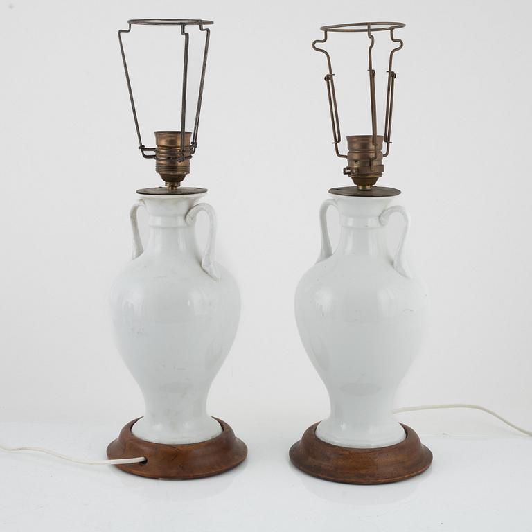 A pair of white porcelain table lamps / urns, Europe 20th century.