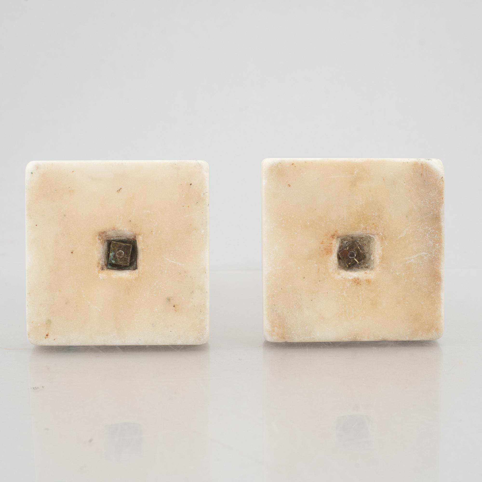 A pair of marble and gilt-bronze Louis XVI-style candelsticks, circa 1900.