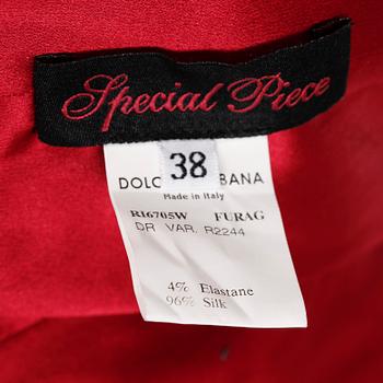 A red silk cocktail dress by Dolce & Gabbana.