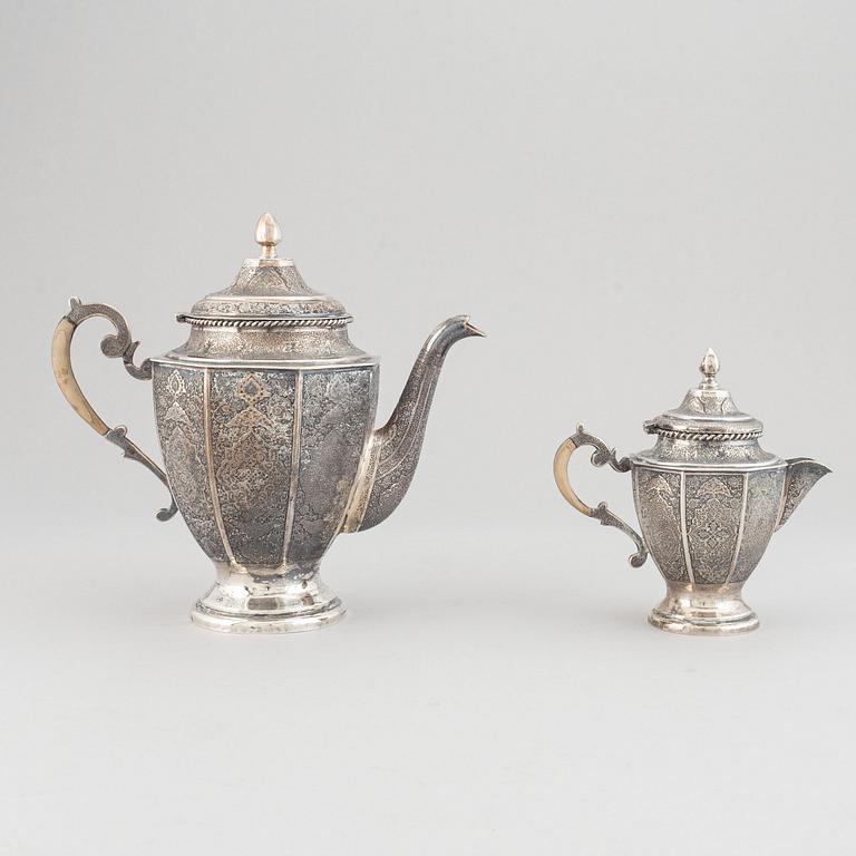 A persian silver coffee-pot and creamer, Iran Isfahan, late Pahlavi dynasty.