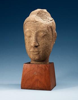 1445. A large Lopbury type (later style) sandstone head of a Buddha, 17/18th Century.