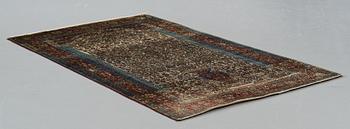 A RUG, an antique silk Kashan, possibly Motachem, ca 208-213,5 x 129,5-132 cm.