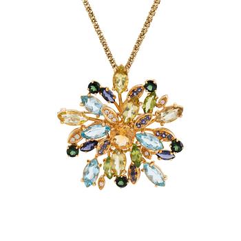 430. A brooch/pendant in 18K gold set with colored stones.