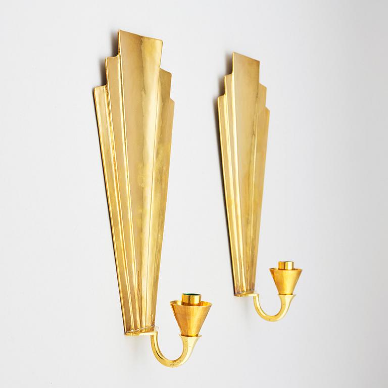 Lars Holmström, a pair of Swedish Grace brass wall sconces, Arvika.