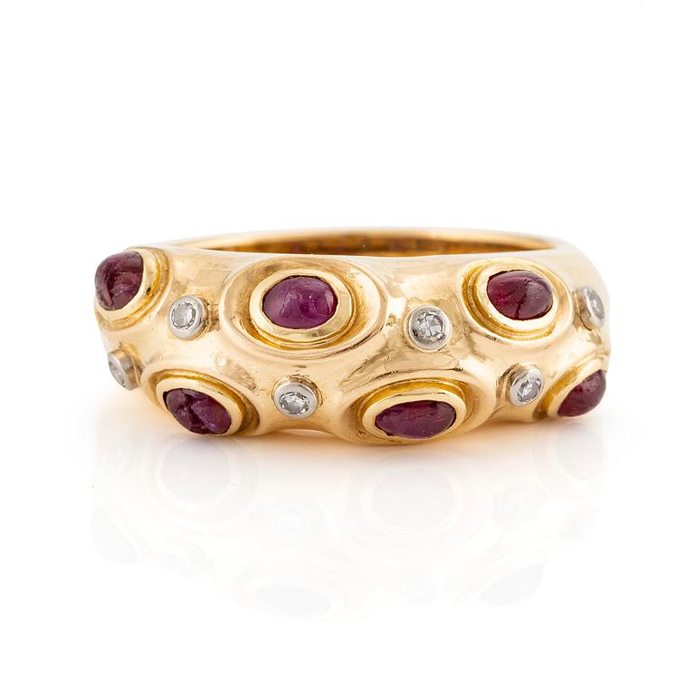 A W.A. Bolin ring in 18K gold with cabochon-cut rubies and eight-cut diamonds.