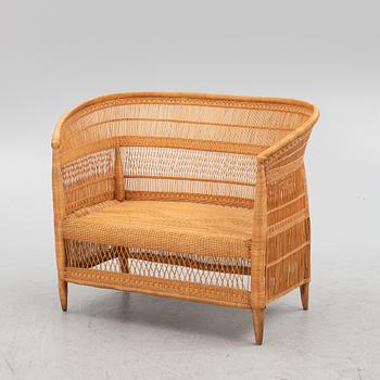 A rattan sofa and a pair of armchairs, second half of the 20th century.