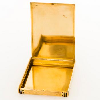 A Cartier cigarette case in 18K gold with black enamel.