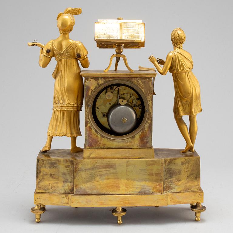 A French Empire gilt bronze mantel clock, first half of the 19th century.