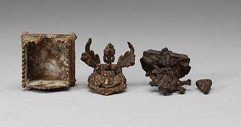 A set of three bronze figures of Buddha and a throne, India, 17/18th Century.