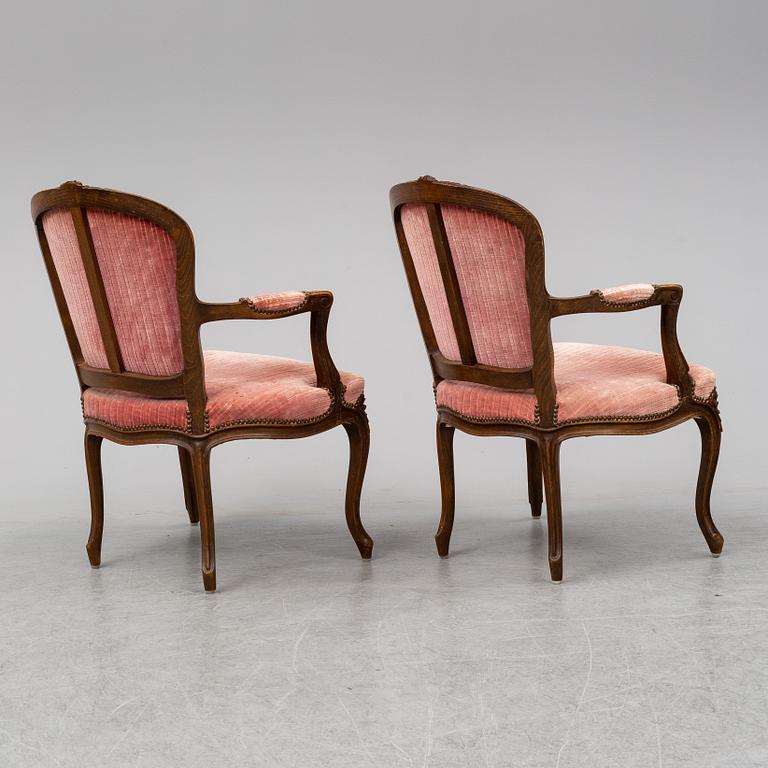 A pair of 19th-century rococo revival arm-chairs.