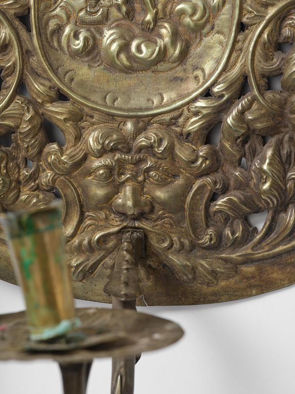 A set of four Swedish Baroque repoussé silvered brass reflector one-branch reflector plates, ca 1690-1700.