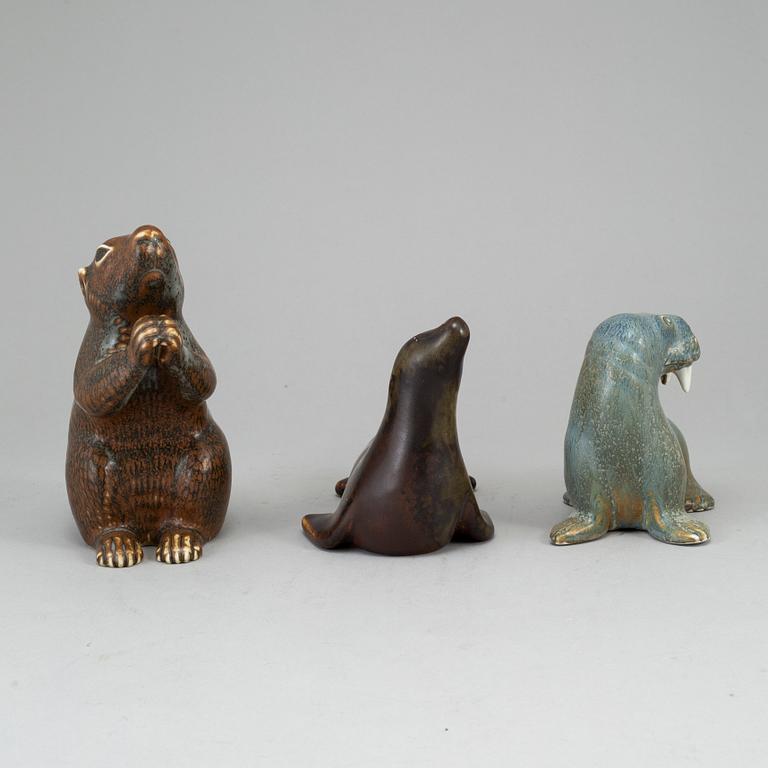GUNNAR NYLUND, a set of thre stoneware sculptures; a squirrel, a walrus and a seal, Rörstrand, Sweden.