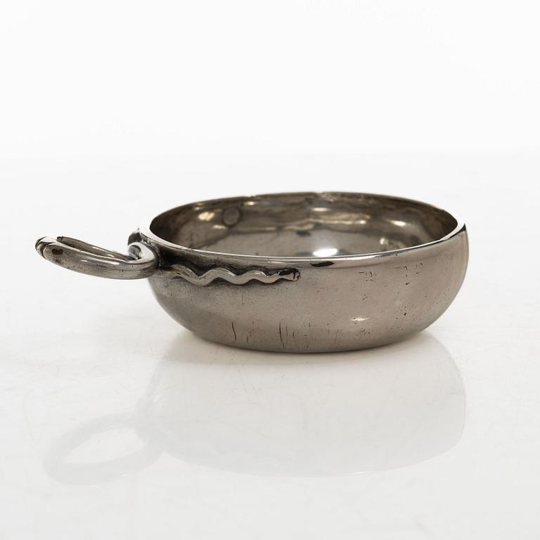 A French silver tastevin, mid-19th Century.