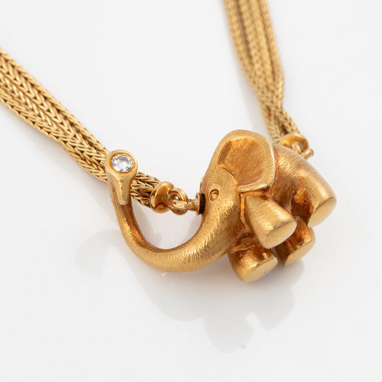 Ole Lynggaard lock 14K gold with a round brilliant-cut diamond.