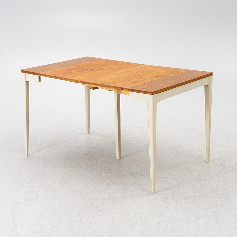 A dining table, mid-20th century.