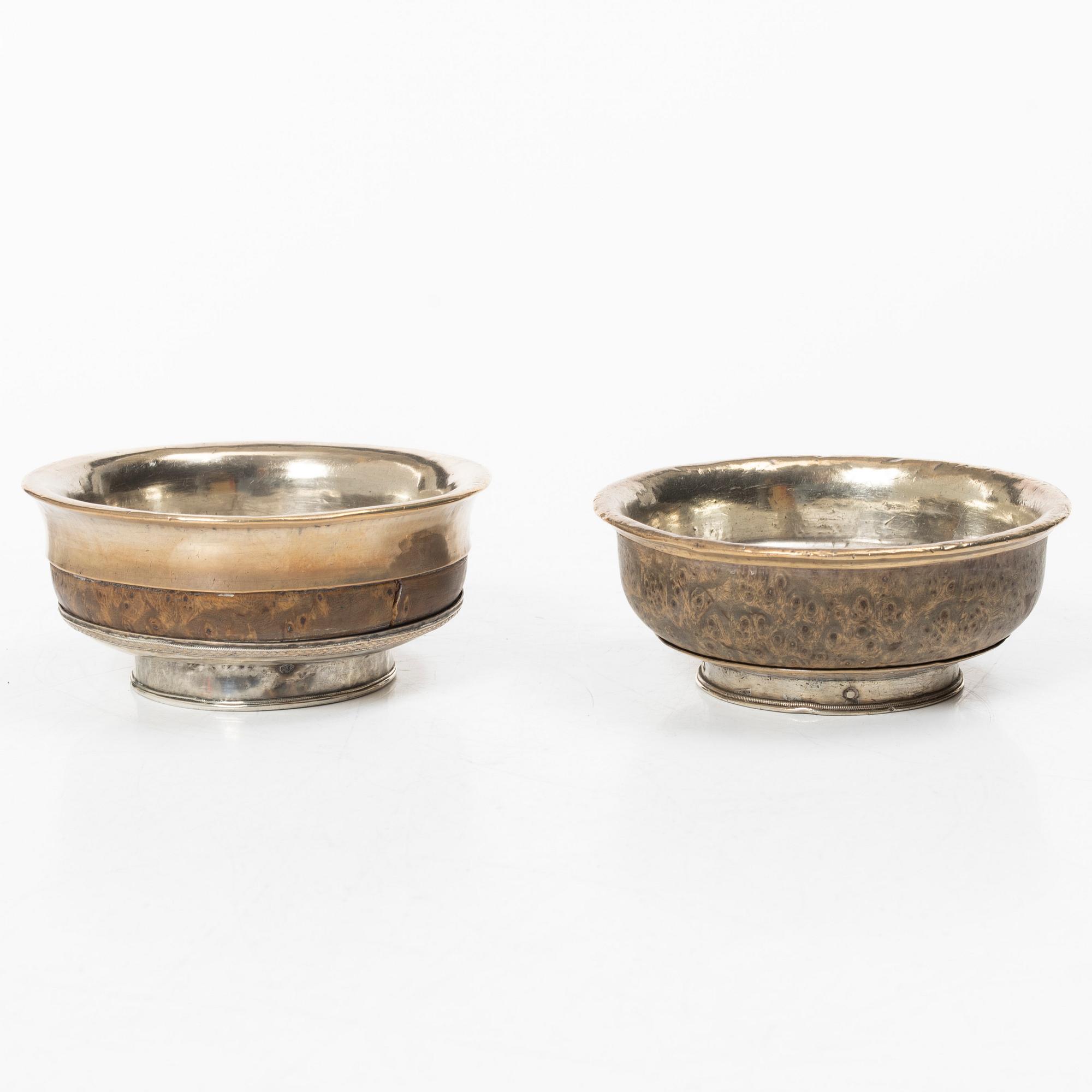 Two Tibetan bowls, low-grade silver and burl-wood, Early 20th century.
