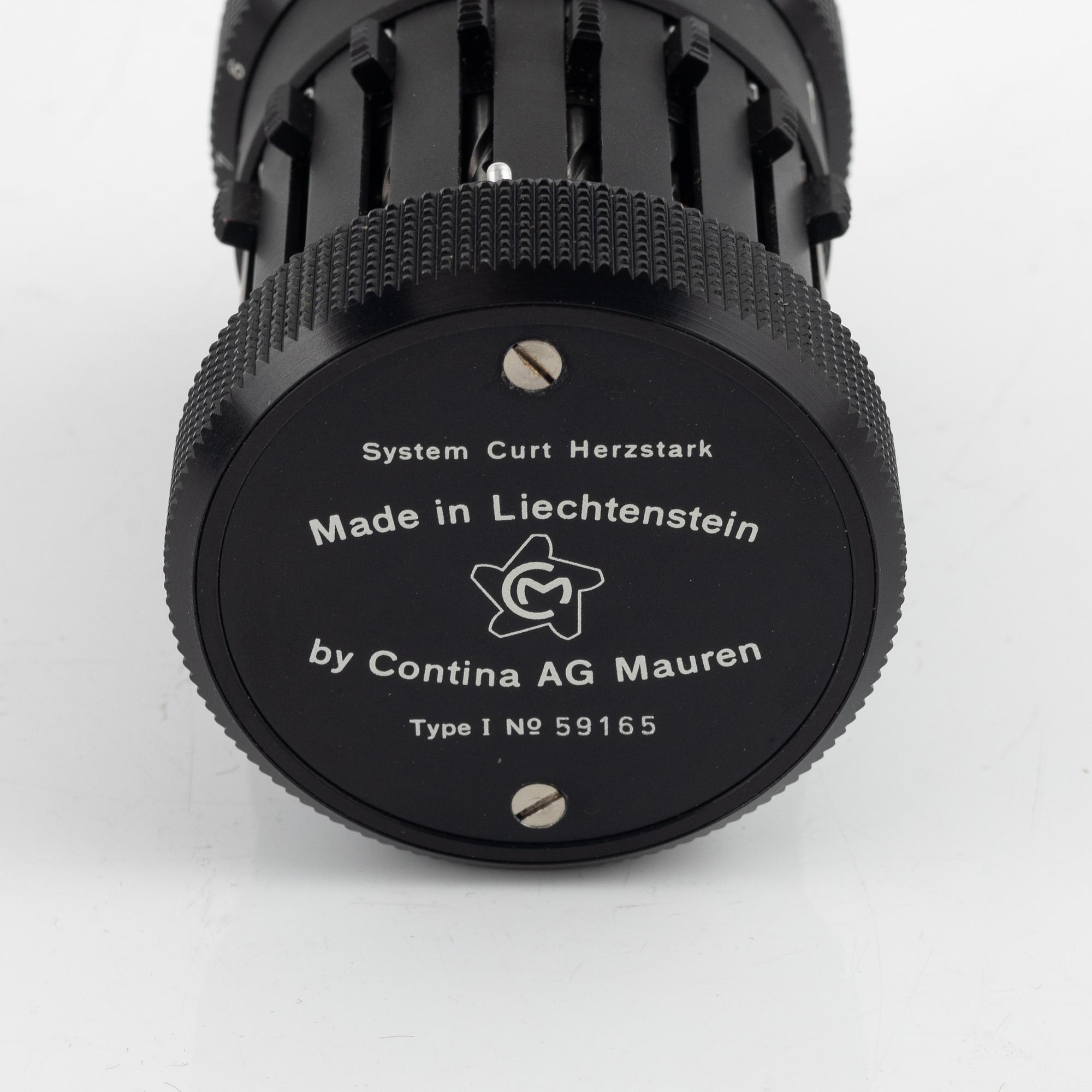 A Curta Type I mechanical calculator.