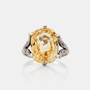 1249. A yellow sapphire, circa 12.26 ct, ring.
