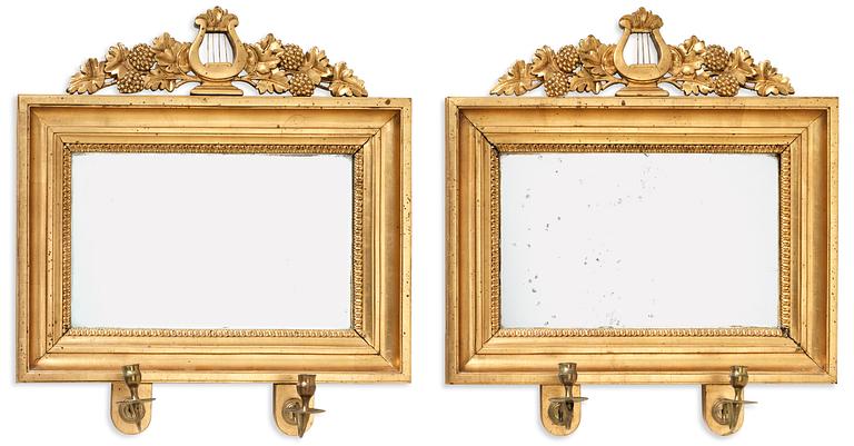 A pair of Swedish Empire two-light girandole mirrors.