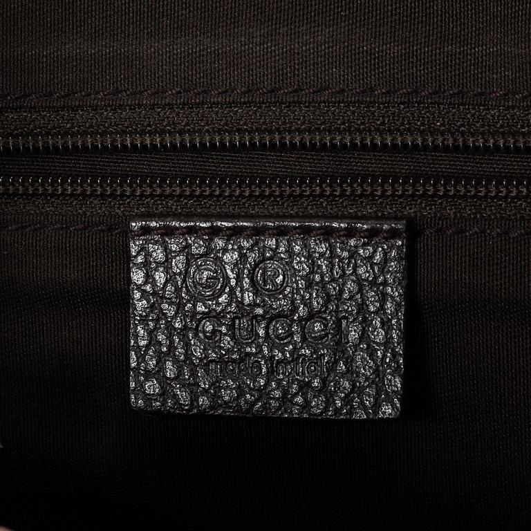 Gucci, GG Supreme bag.