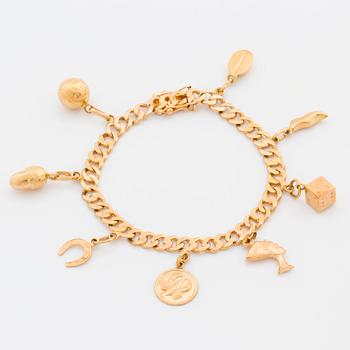 BRACELET 18K GOLD WITH 8 CHARMS.