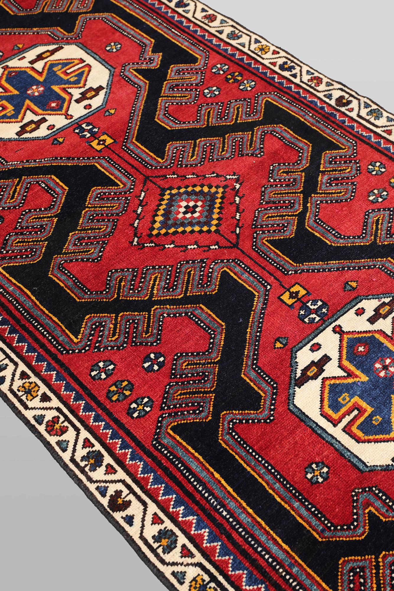 A semi-antique runner carpet, 295 x 100 cm.
