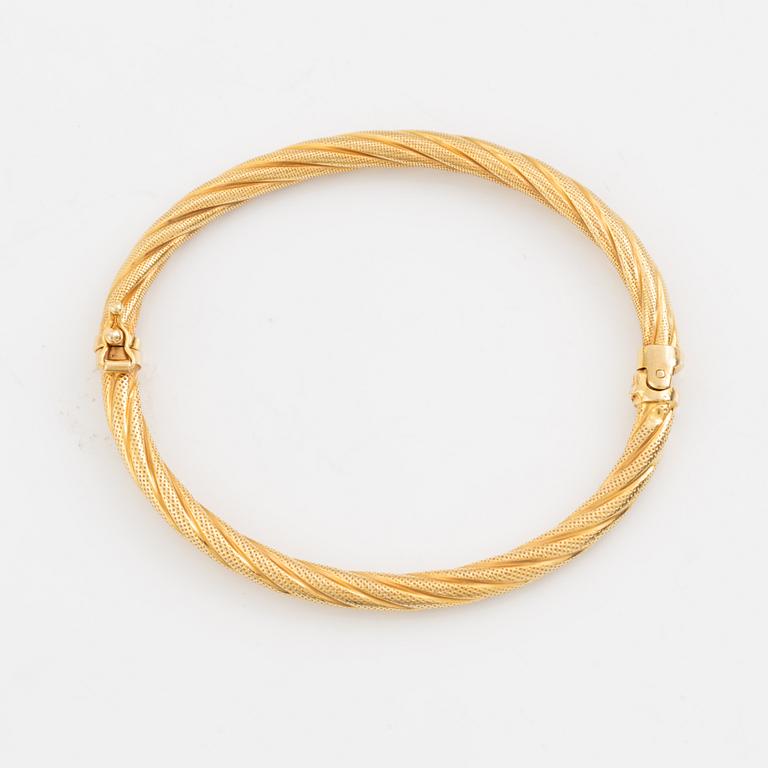 Armring, vriden dekor, guld.