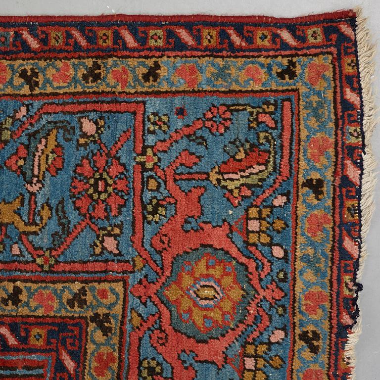 A carpet, an antique/semi-antique Heriz, ca 352 x 275 cm.