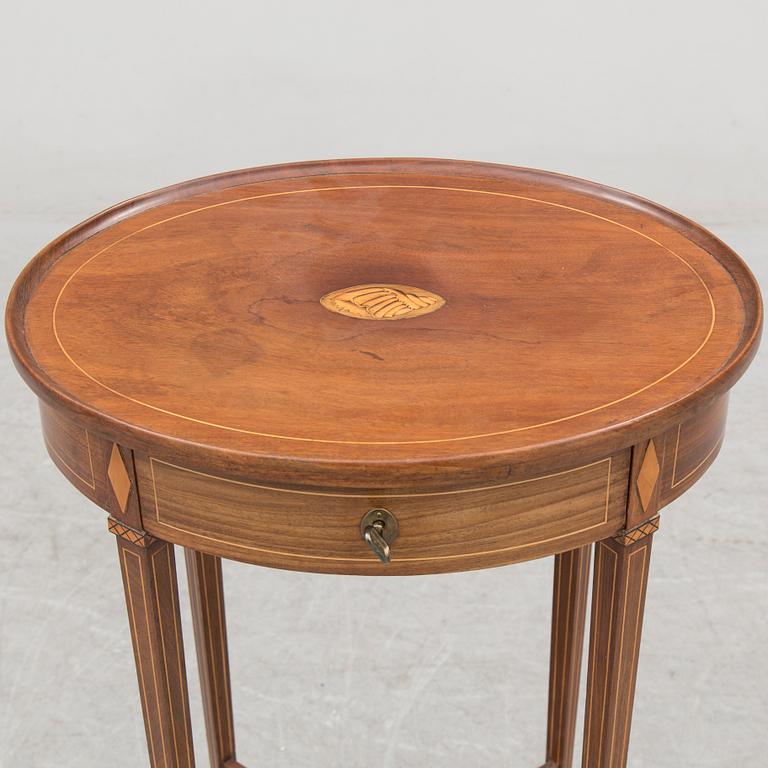 An early 19th century mahogany veneered table.