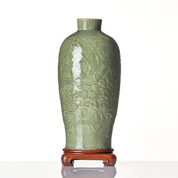 A carved celadon 'longquan' vase, Yuan/Ming dynasty.