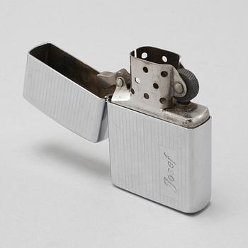 Three ligthers by Pierre Cardin, Ronson and Zippo and shopsticks and a scent bottle from Christofle.