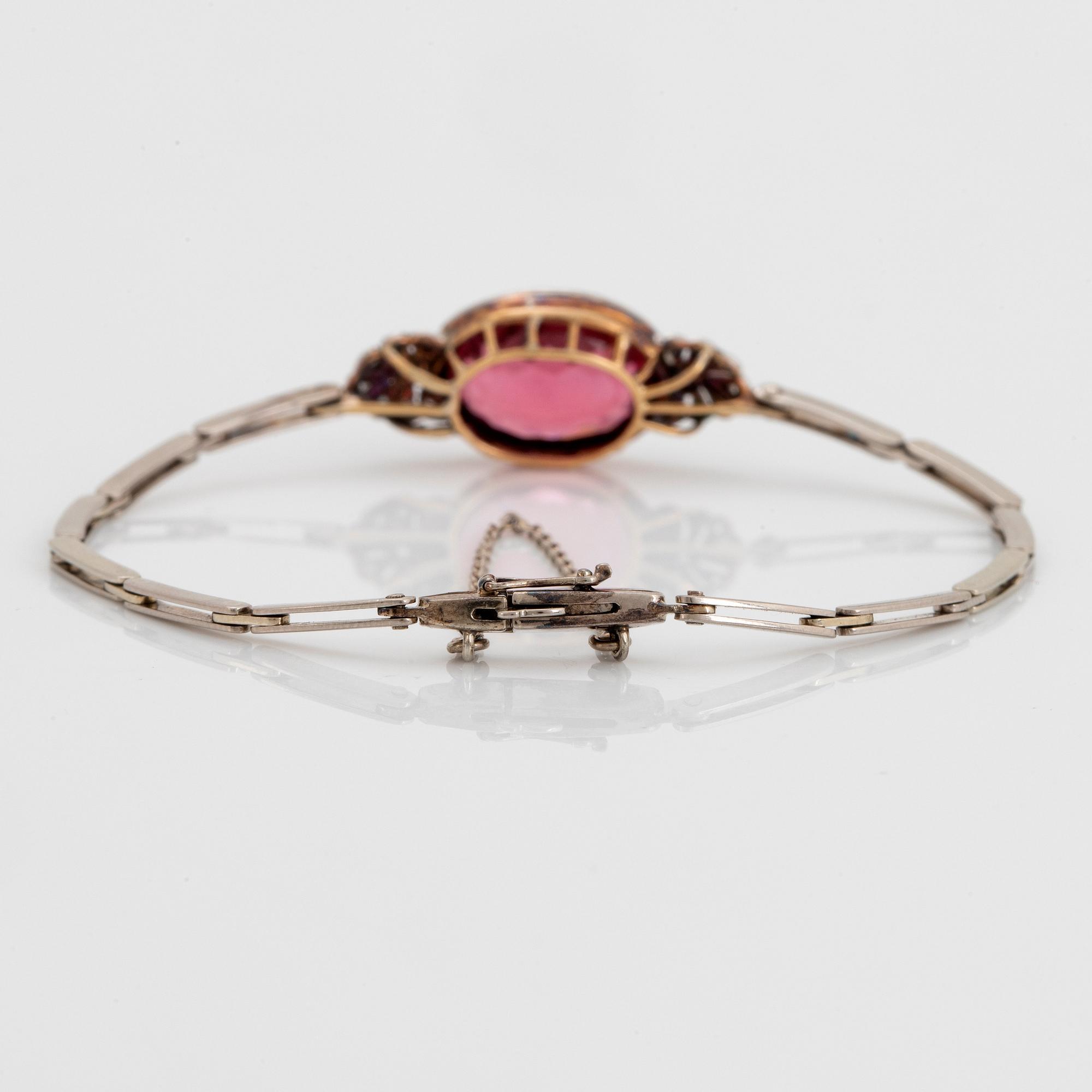 An 18K gold bracelet set with a faceted pink tourmaline weight ca 6.00 cts.