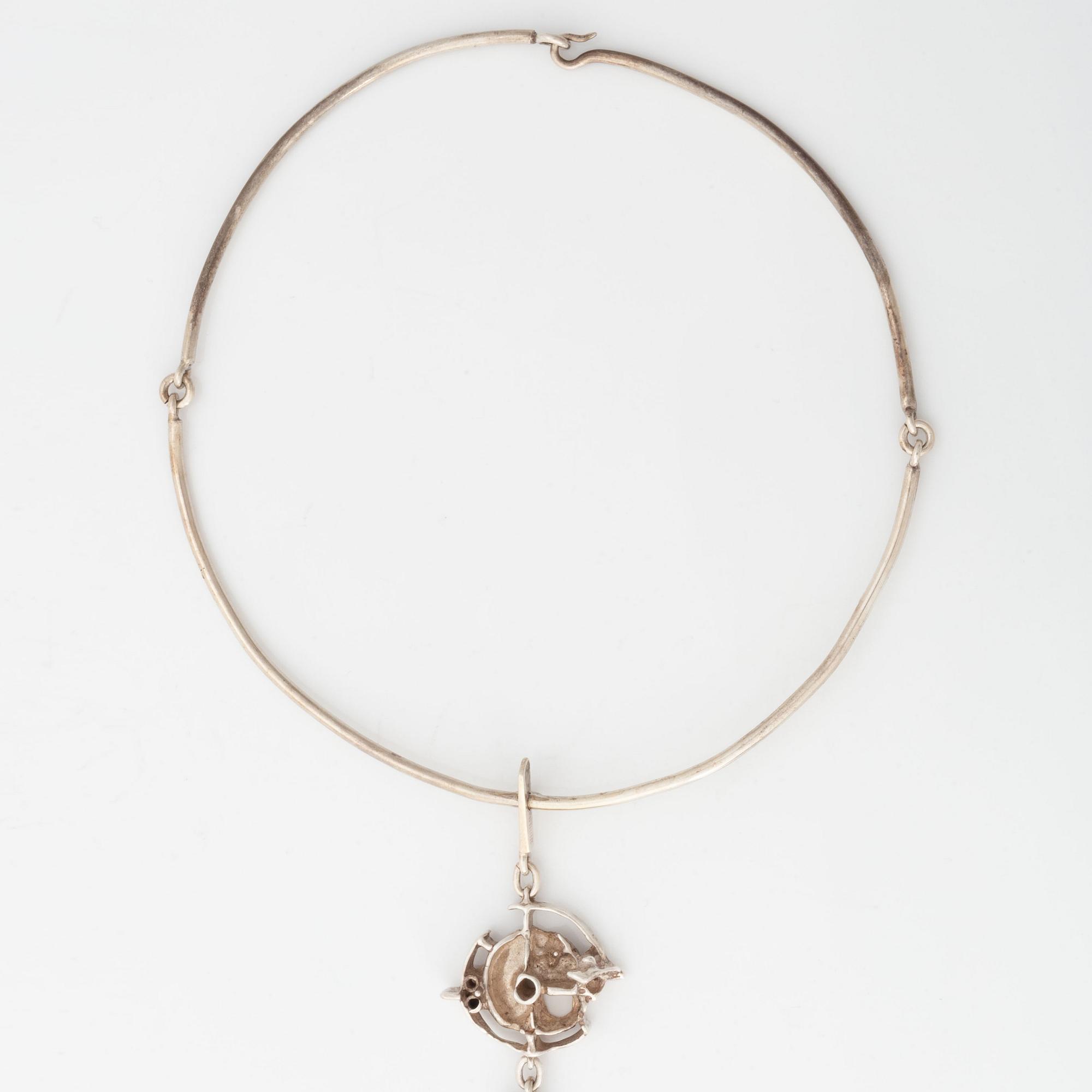 Juhls silver necklace.