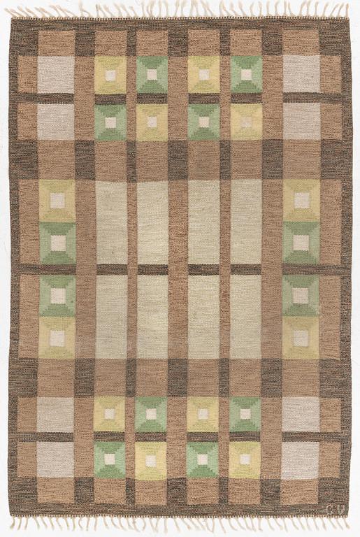 A flat weave carpet, signed, ca. 243 x 165 cm.