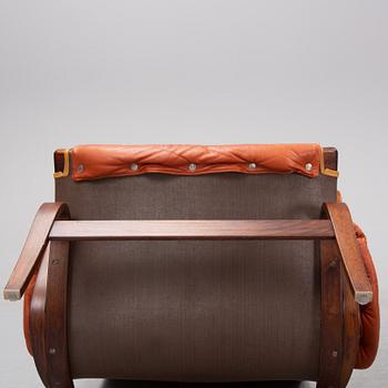 An end of the 20th Century pair of 'Pernilla' easy chairs with leather upholstery by Bruno Mathsson for DUX.