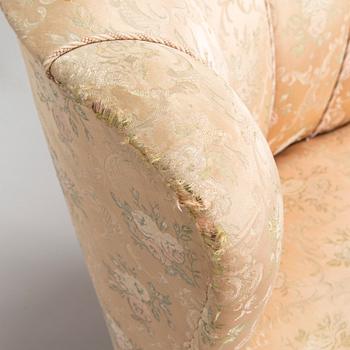 A pair of mid-20th century armchairs.