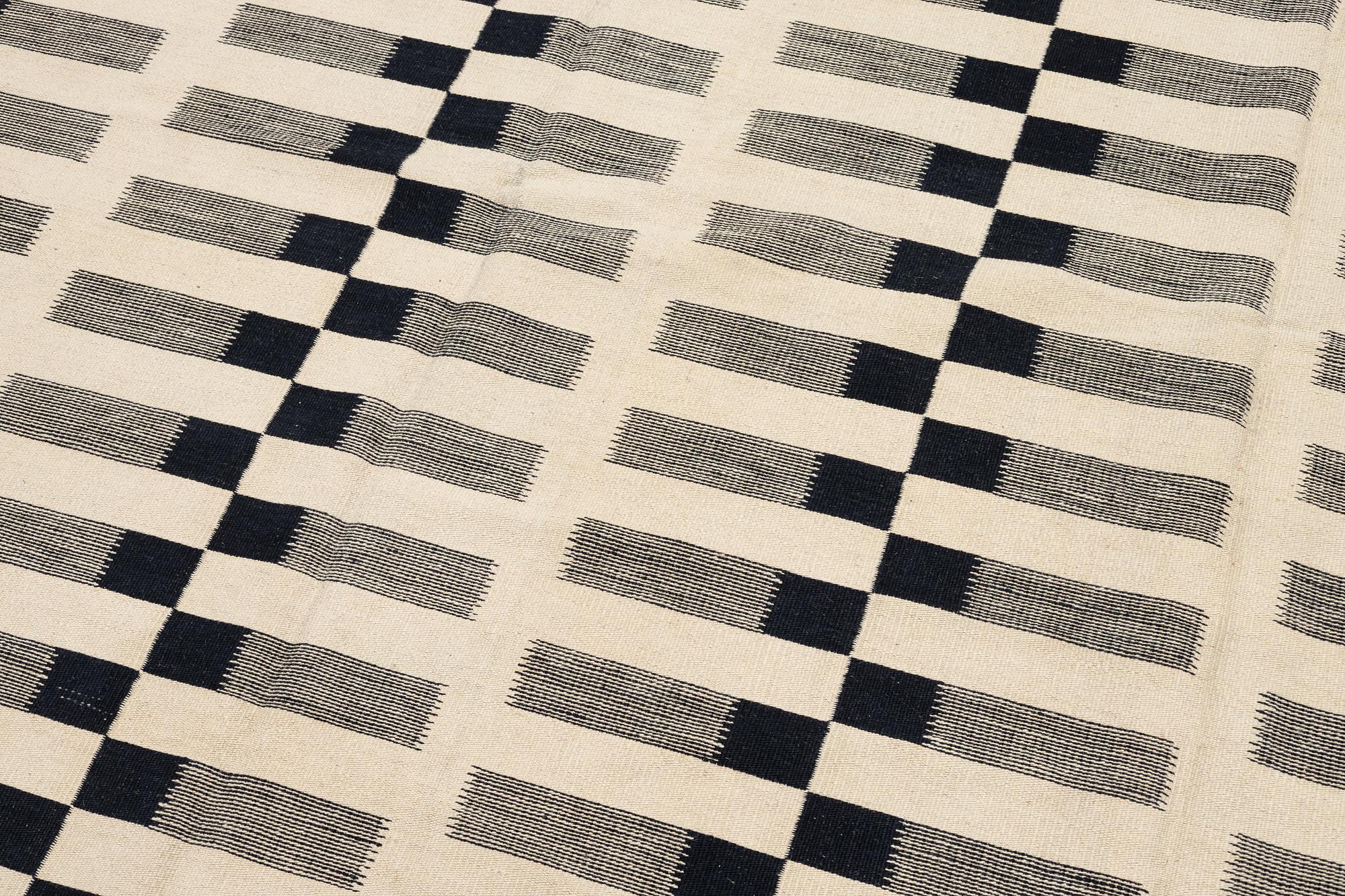 A flat-woven rug, c. 232 x 175 cm.
