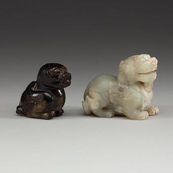 Two Chinese stone figures of mythical beasts.