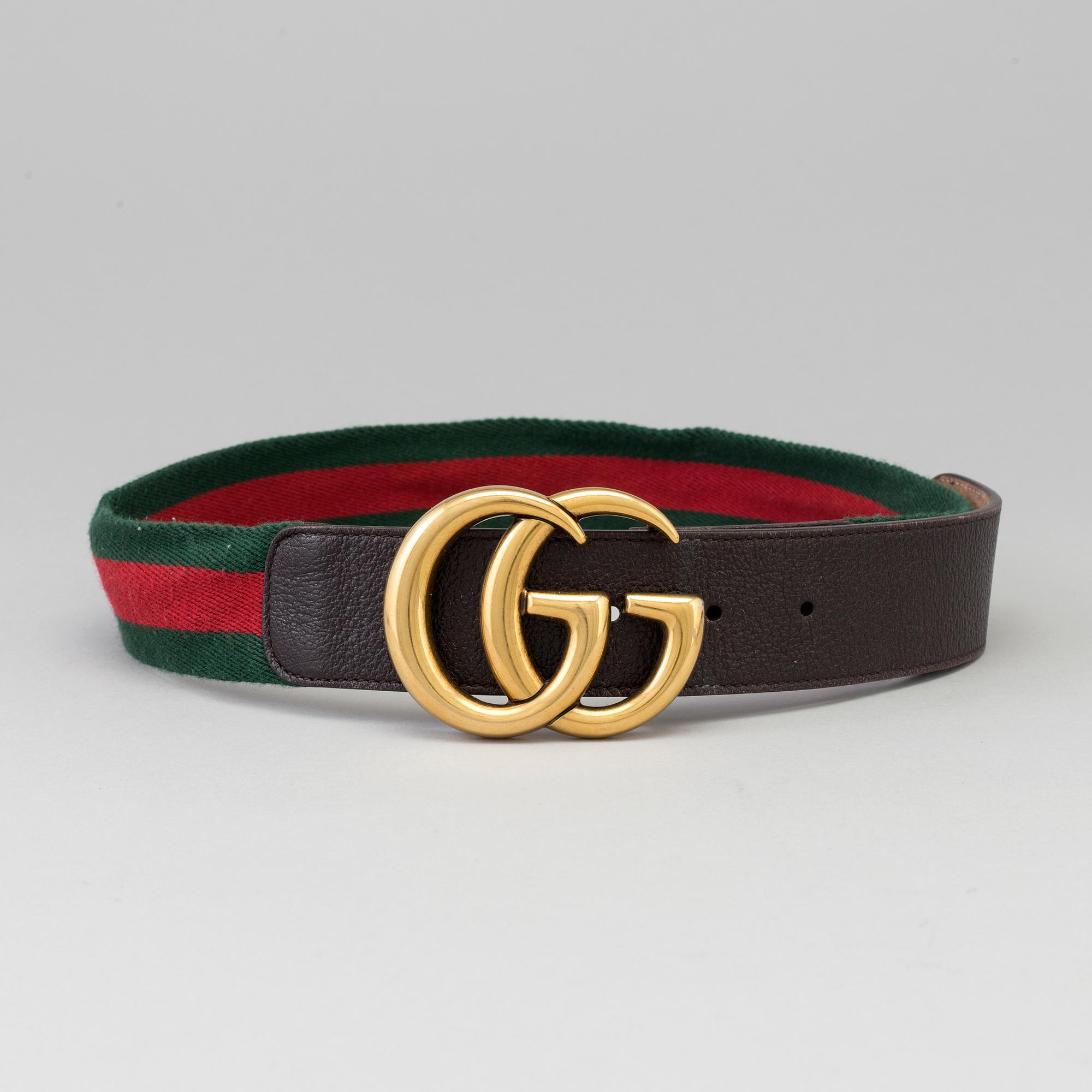 A canvas belt by Gucci. Bukowskis