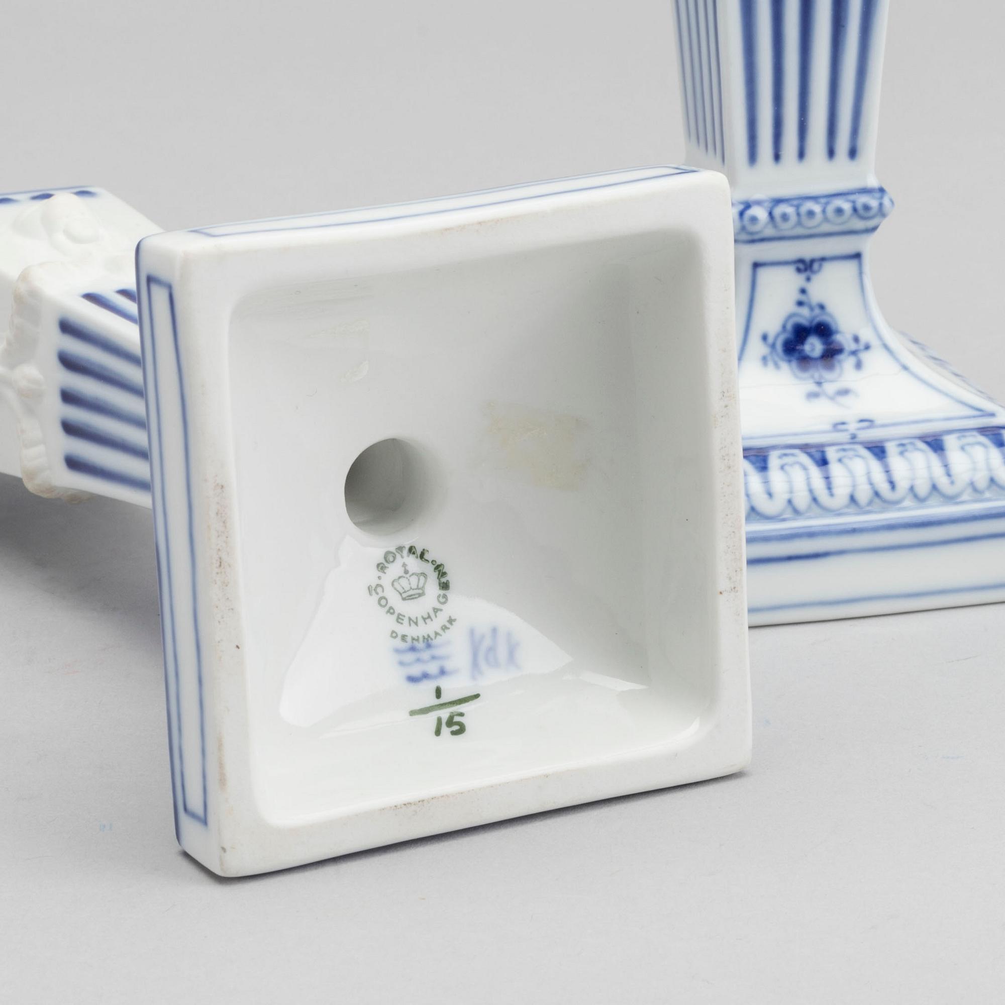 A PAIR OF ROYAL COPENHAGEN PORCELAIN CANDLE STICKS.