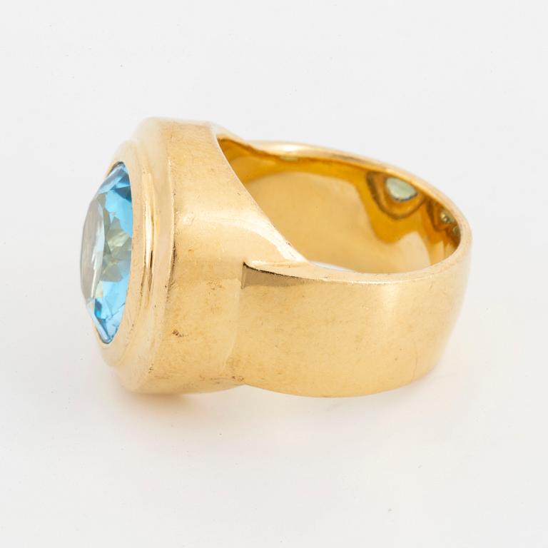 A faceted topaz ring.