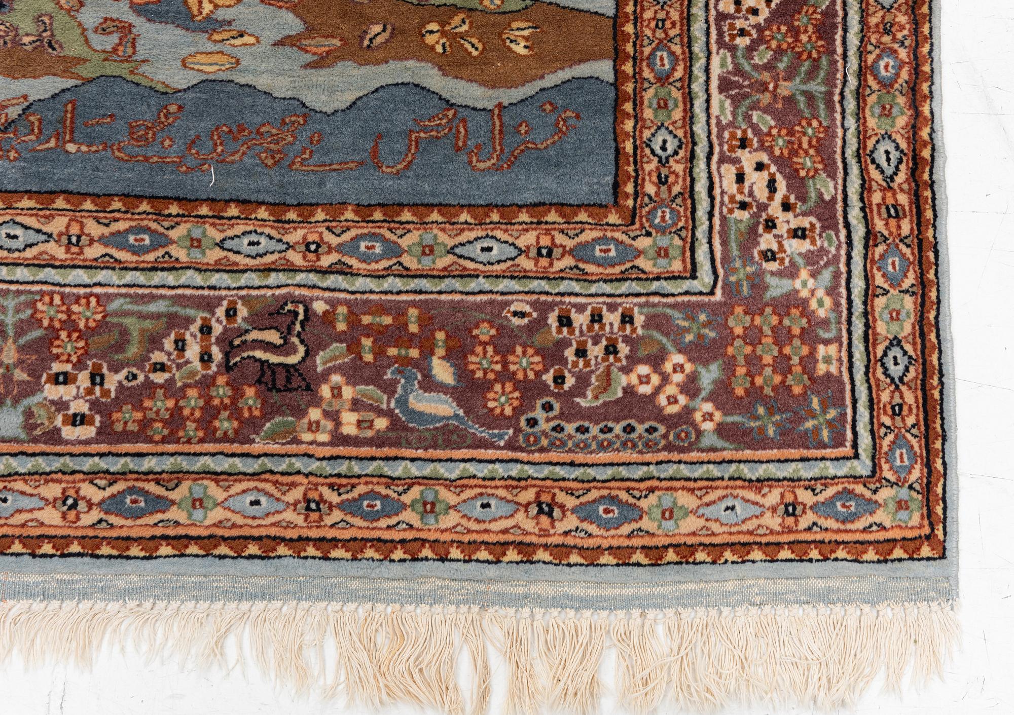 An oriental figural rug, c. 182 x 128 cm.