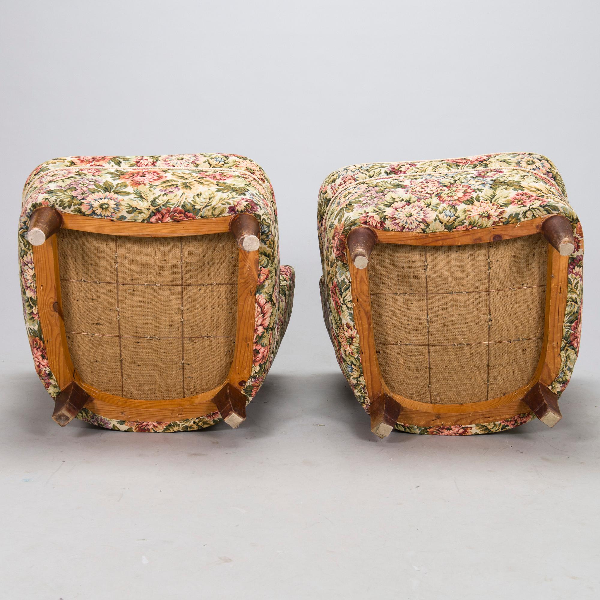 A pair of mid-20th-century armchairs.