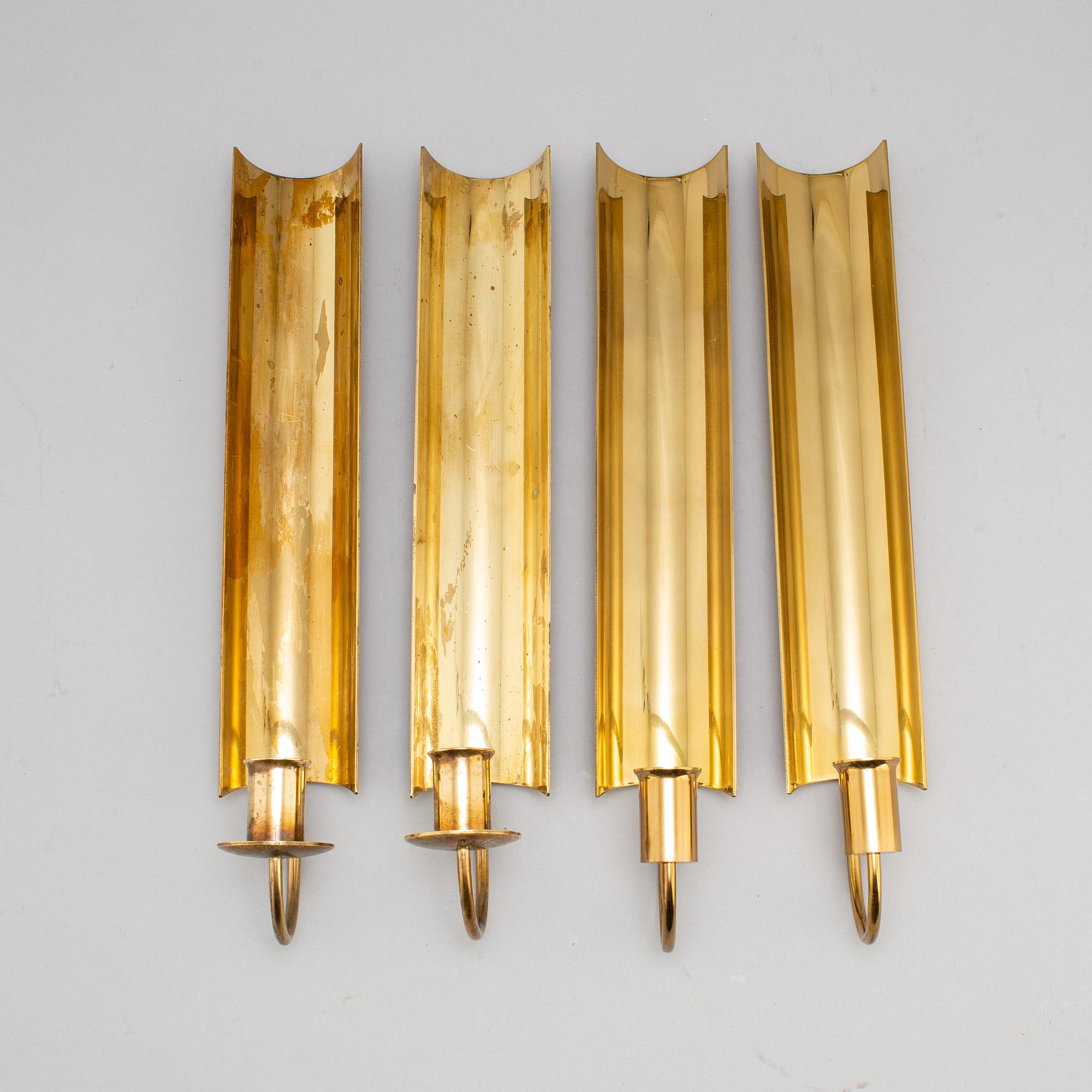 A set of four 'Reflex' brass wall scones by Pierre Forsell, Skultuna.